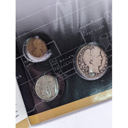 414 - Coins of the Titanic - a booklet which houses five USA coins each dated 1912, comprising of Half Dol... 