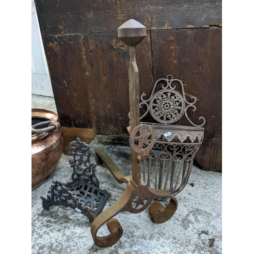 222 - A copper twin ring handled planter, wall hanging flower basket, wrought iron fire dog, and one other... 