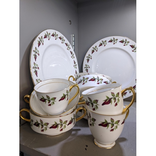 287 - A Shelley 'Wild Roses' part dinner service comprising dinner plates, side plates cups and saucers, s... 