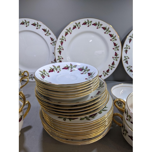 287 - A Shelley 'Wild Roses' part dinner service comprising dinner plates, side plates cups and saucers, s... 