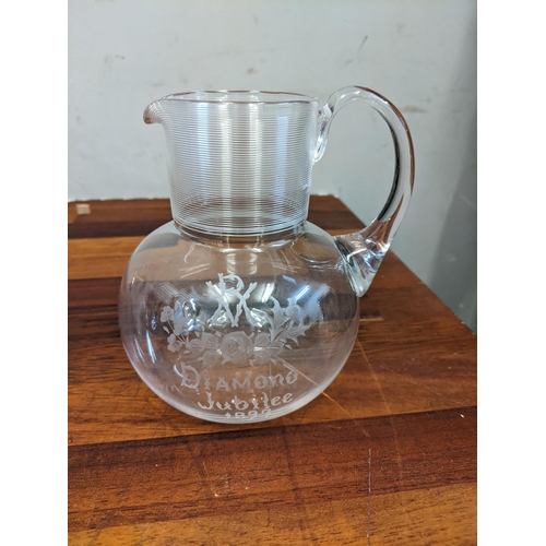 293 - Mixed 19th century and later glassware to include a pair of Victorian etched glass decanters, commem... 