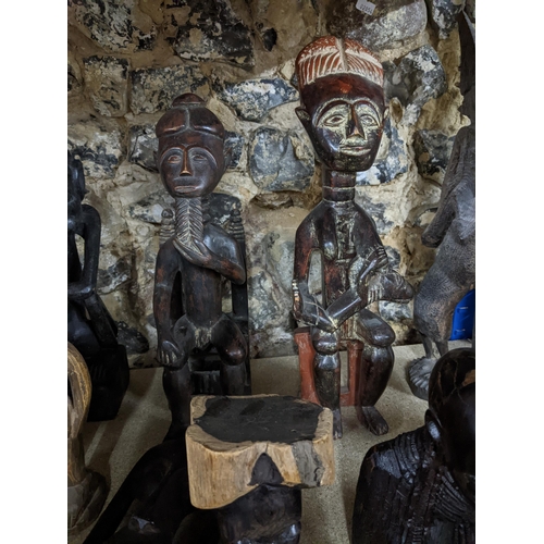 352 - A group of African tribal art carved wooden figures and busts to include an Ashanti fertility figure... 