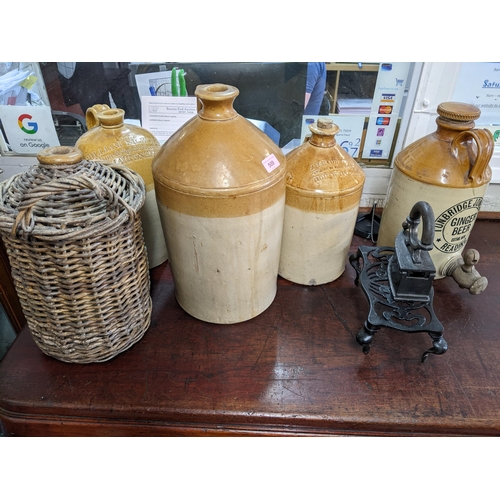 509 - A group of stoneware bottles to include a William Nicholson Maidenhead jar, and an A Leadbetter High... 