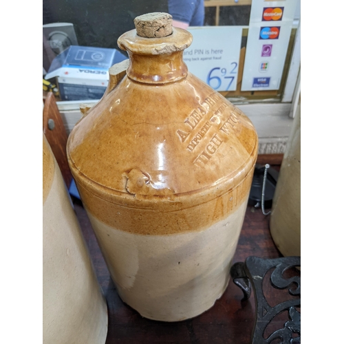 509 - A group of stoneware bottles to include a William Nicholson Maidenhead jar, and an A Leadbetter High... 