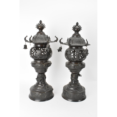 10 - A pair of Japanese Meiji period bronze koros in the form of temples with pagoda roof with bells, ret... 