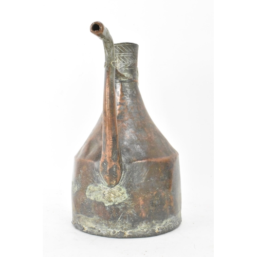 103 - A late 19th/early 20th century Islamic handmade copper water jug, the top having incised repeated de... 