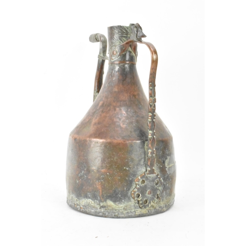 103 - A late 19th/early 20th century Islamic handmade copper water jug, the top having incised repeated de... 