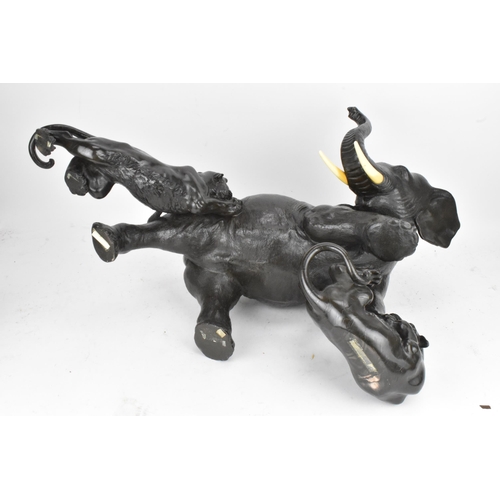 111 - A Japanese Meiji period bronze group modeled as an elephant being attacked by three Siberian tigers,... 