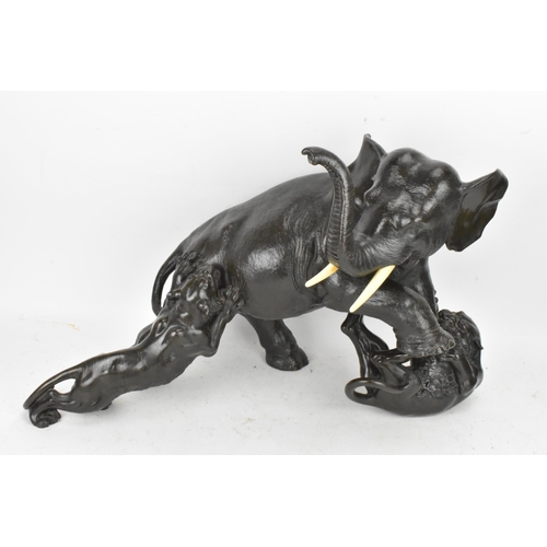 111 - A Japanese Meiji period bronze group modeled as an elephant being attacked by three Siberian tigers,... 