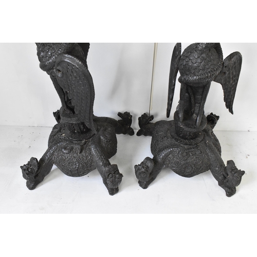 117 - A pair of late 19th century Anglo-Indian colonial ebonized carved plant stands, each having ornately... 