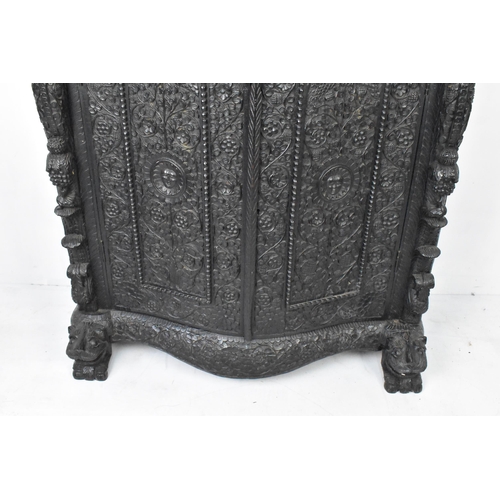 120 - A 19th century Anglo Indian colonial black lacquered hardwood cabinet, serpentine fronted and profus... 