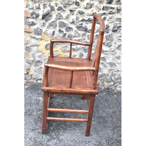 122 - A pair of 20th century Chinese Ming style hardwood armchairs, with curved top rail and curved centra... 