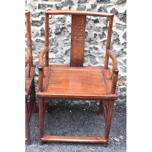 122 - A pair of 20th century Chinese Ming style hardwood armchairs, with curved top rail and curved centra... 