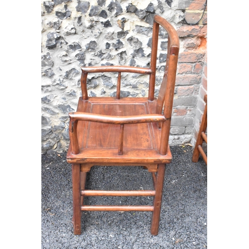 122 - A pair of 20th century Chinese Ming style hardwood armchairs, with curved top rail and curved centra... 