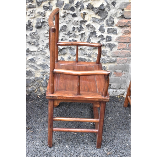 122 - A pair of 20th century Chinese Ming style hardwood armchairs, with curved top rail and curved centra... 