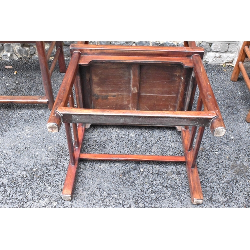 122 - A pair of 20th century Chinese Ming style hardwood armchairs, with curved top rail and curved centra... 