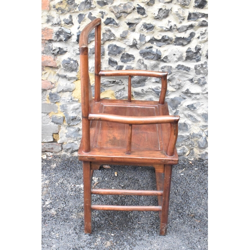 122 - A pair of 20th century Chinese Ming style hardwood armchairs, with curved top rail and curved centra... 