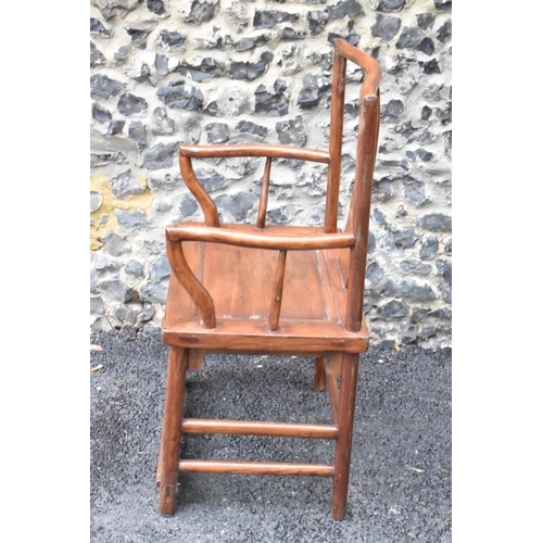 123 - A pair of 20th century Chinese Ming style hardwood armchairs, with curved top rail and curved centra... 