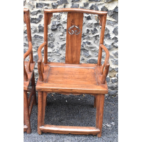 123 - A pair of 20th century Chinese Ming style hardwood armchairs, with curved top rail and curved centra... 