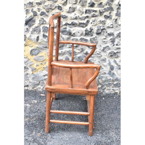 123 - A pair of 20th century Chinese Ming style hardwood armchairs, with curved top rail and curved centra... 