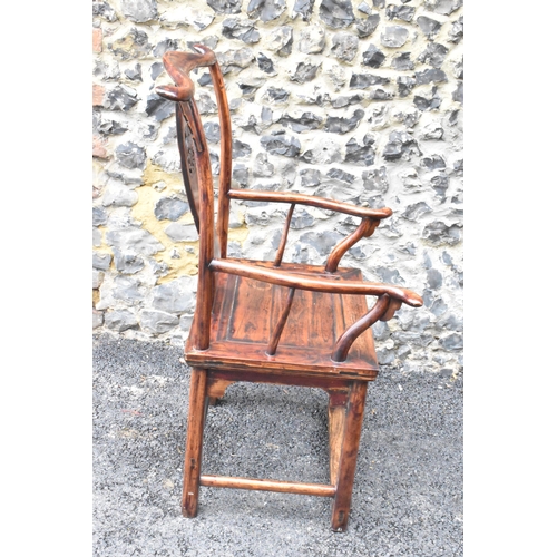 124 - A pair of 20th century Chinese Ming style yoke back hardwood armchairs, with curved top rail and cur... 