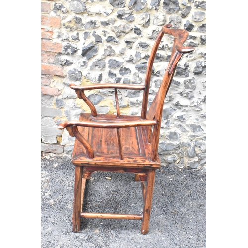 124 - A pair of 20th century Chinese Ming style yoke back hardwood armchairs, with curved top rail and cur... 