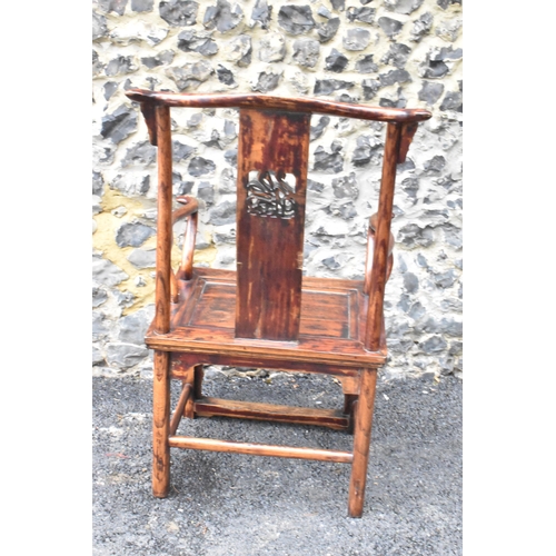 124 - A pair of 20th century Chinese Ming style yoke back hardwood armchairs, with curved top rail and cur... 