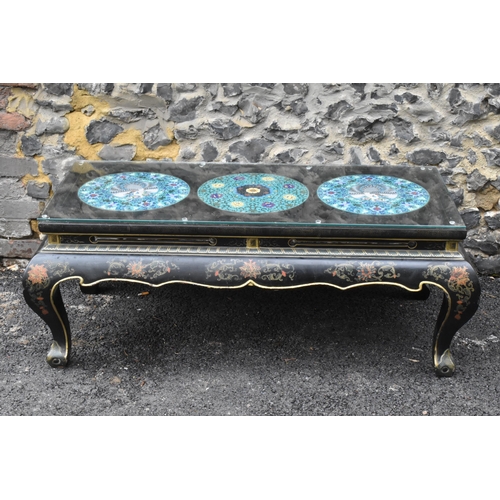 125 - A Chinese 20th century cloisonne coffee table, the black  lacquered low coffee table with a rectangu... 