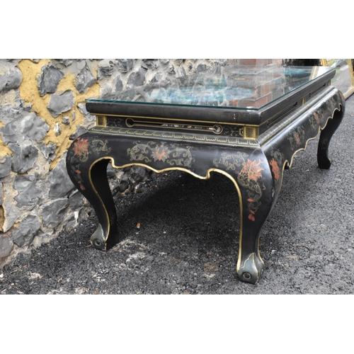 125 - A Chinese 20th century cloisonne coffee table, the black  lacquered low coffee table with a rectangu... 