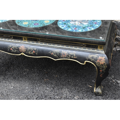 125 - A Chinese 20th century cloisonne coffee table, the black  lacquered low coffee table with a rectangu... 