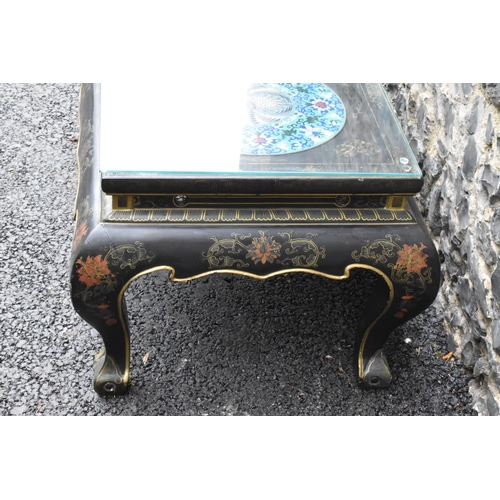 125 - A Chinese 20th century cloisonne coffee table, the black  lacquered low coffee table with a rectangu... 