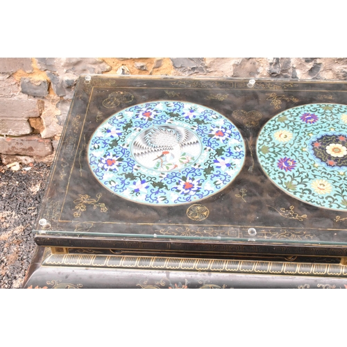 125 - A Chinese 20th century cloisonne coffee table, the black  lacquered low coffee table with a rectangu... 