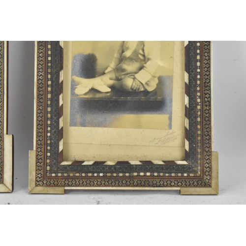 126 - Two similar Persian late Qajar dynasty photograph frames, the profusely inlaid frames having multi g... 