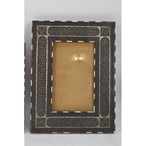 127 - Three similar Persian late Qajar dynasty photograph frames, the profusely inlaid frames having micro... 