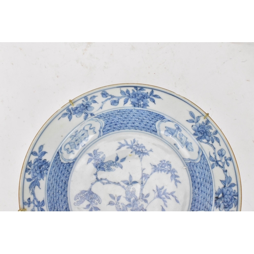 129 - A Chinese Qing dynasty bowl, 18th century, blue and white underglaze decoration depicting bamboo tre... 