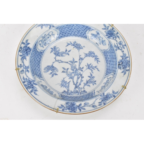 129 - A Chinese Qing dynasty bowl, 18th century, blue and white underglaze decoration depicting bamboo tre... 