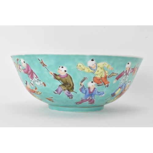 13 - A Chinese Famille Rose porcelain bowl, on a turquoise ground and decorated in various enamels depict... 