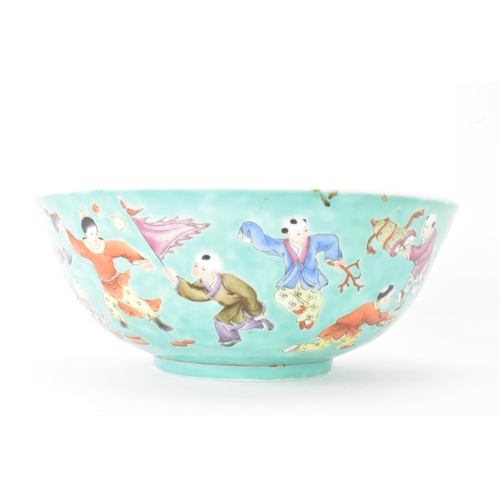 13 - A Chinese Famille Rose porcelain bowl, on a turquoise ground and decorated in various enamels depict... 