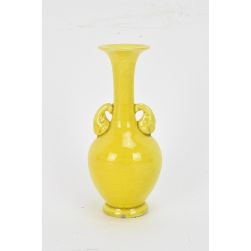 134 - A 20th century Japanese miniature famille jaune glazed vase, having an elongated neck, flared rim wi... 