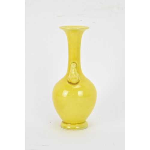 134 - A 20th century Japanese miniature famille jaune glazed vase, having an elongated neck, flared rim wi... 