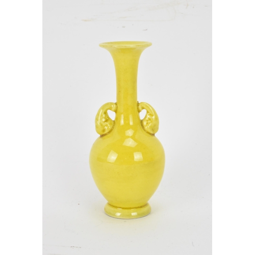 134 - A 20th century Japanese miniature famille jaune glazed vase, having an elongated neck, flared rim wi... 