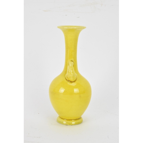 134 - A 20th century Japanese miniature famille jaune glazed vase, having an elongated neck, flared rim wi... 