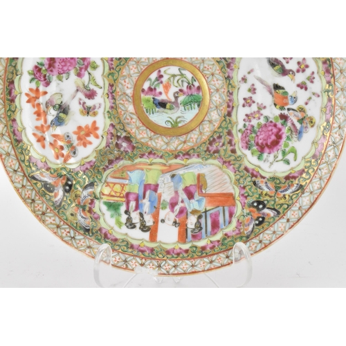 135 - A pair of Chinese export late 19th century Canton Famille Rose porcelain plates, in polychrome ename... 