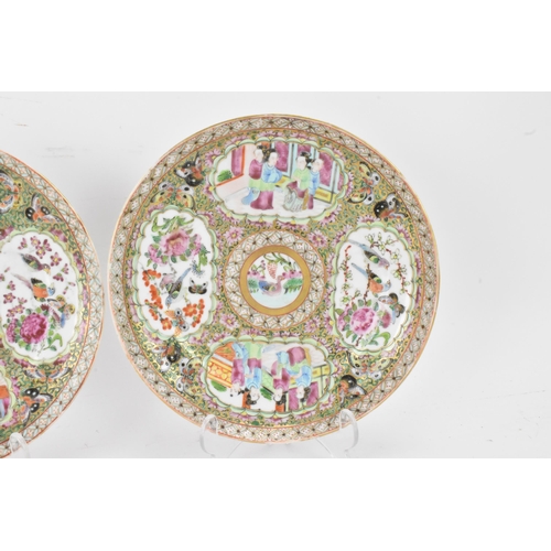 135 - A pair of Chinese export late 19th century Canton Famille Rose porcelain plates, in polychrome ename... 