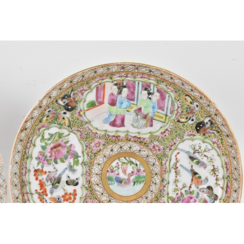 135 - A pair of Chinese export late 19th century Canton Famille Rose porcelain plates, in polychrome ename... 