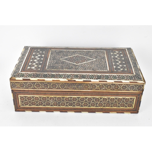 150 - A Persian late Qajar dynasty ink blotter and rectangular formed cigarette box, both profusely decora... 