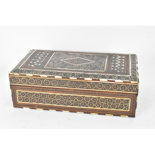 150 - A Persian late Qajar dynasty ink blotter and rectangular formed cigarette box, both profusely decora... 