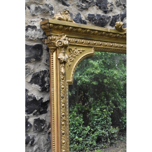 152 - A 19th century French Louis XVI style large gilt wall mirror, having a sevres style painted plaque d... 