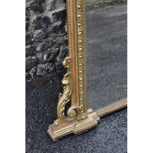 152 - A 19th century French Louis XVI style large gilt wall mirror, having a sevres style painted plaque d... 