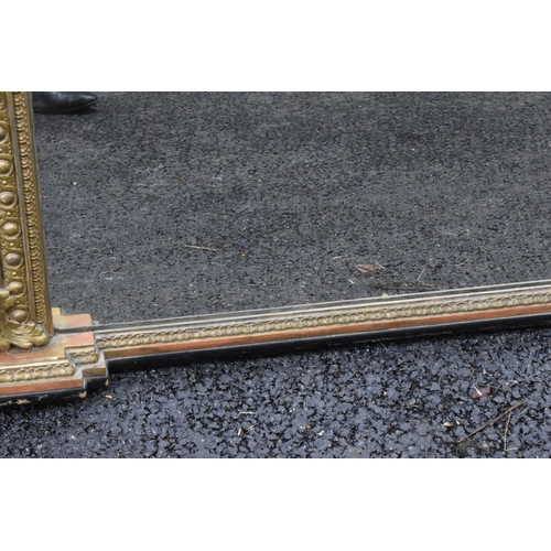 152 - A 19th century French Louis XVI style large gilt wall mirror, having a sevres style painted plaque d... 